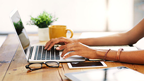 Woman typing on laptop