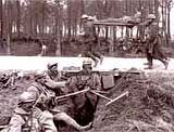 Image of a wounded British soldier passing through the Franco-British outpost line, March 1918