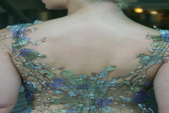 Model wears dress made of glass