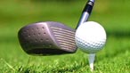 A golf club and ball