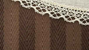 Doily over brown cloth