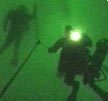 Divers make their way up from the seabed