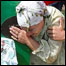 Mulher participa de cerimônia em memória dos mortos em Srebrenica. Foto: AP