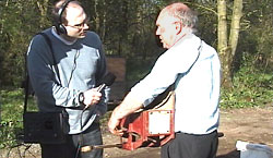 Fred Faulkner (right) explains the workings of a  fiddle  to John Gregg