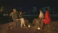 Presenters pointing into the night
