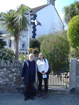 Bert & Dawn by the flag of St Piran, the patron saint of Cornwall
