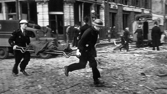 Air raid wardens race to the rescue in Farringdon, London, after a V2 rocket explosion in March 1945.