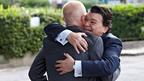 Two men embracing