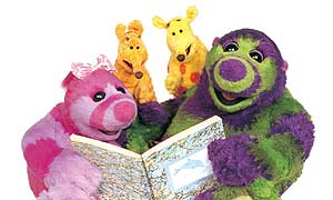 Roly Mo (right) reading to Little Bo,  Yugo and Migo