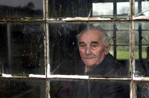 Davey George looking out through the window of his 1940s workshop