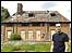 Ian Silverstein outside his ruined house