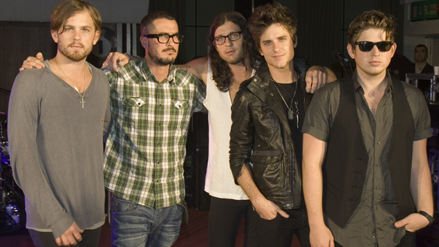 Zane and the band pose for photos before the gig starts.