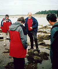 Tom McErlean (centre)  explains stone fish trap design