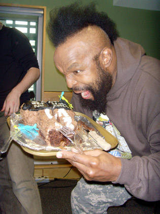 Mr T gets to grips with a chocolate cake.