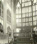Image of north side of Gloucester Cathedral choir showing carving and windows 
