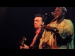 Justin Adams with Juldeh Camara live at the Old Fruitmarket. Photo by Louis Decarlo
