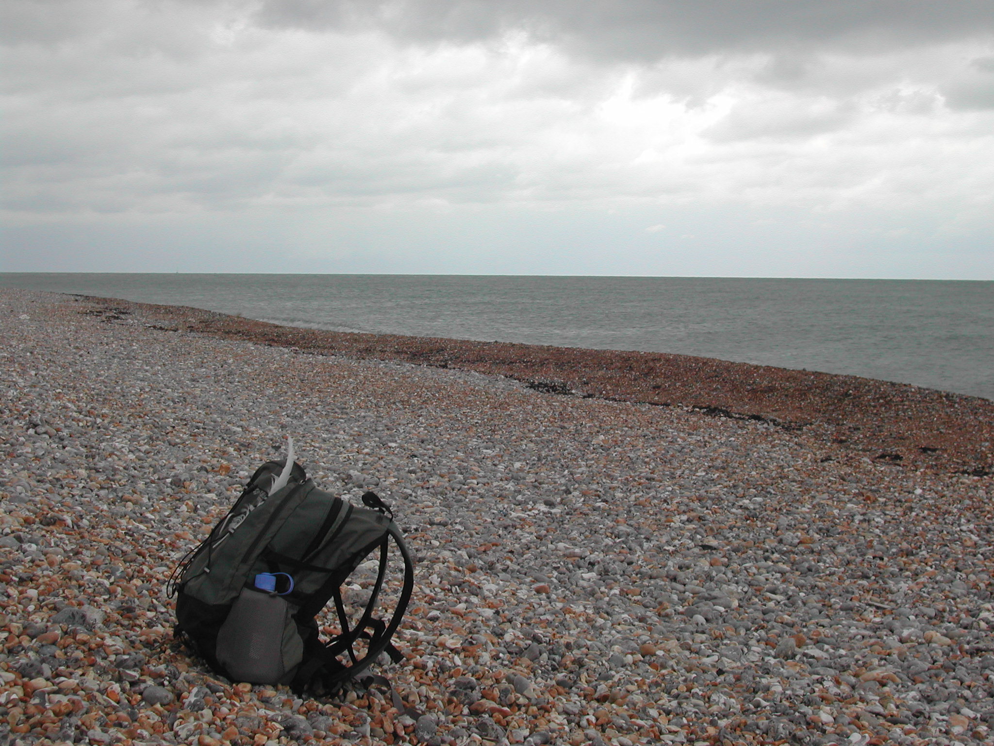 backpack on a shingle beach