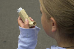 Girl using an inhaler