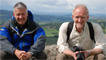 Derek and Jim sat on a wall in Montgomery Castle