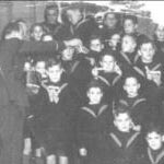 Here is a photograph of me and the other boys in the Orphanage, wearing our sailor uniforms.  This was taken in 1940.  I am on one knee and the taller of the two at the front.