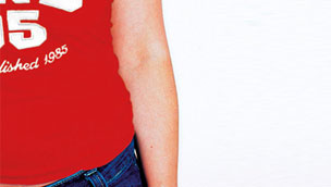 Model in jeans and red top