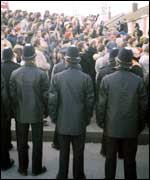 Police and a crowd