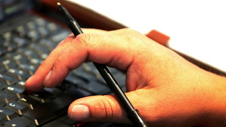 A laptop and pen