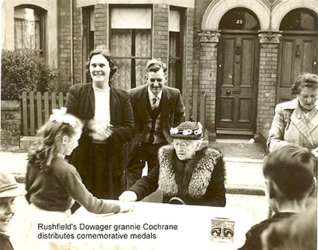 Grannie Cochrane presents  some medals