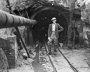 Sam McMurray, the contractor's engineer standing at the Dunnywater entrance in 1950