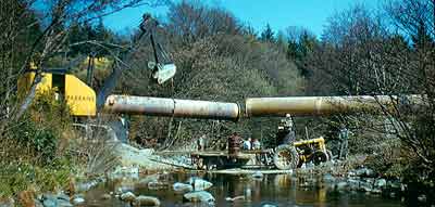 The new triplicate conduit crossing a river in the early '50s