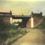 THIS IS A PHOTOGRAPH OF A RAILWAY BRIDGE IN TORNAUI. THIS WAS No. 3 BREN CARRIER SECTIONS POSITIONS FROM MAY 13TH. TO MAY 21ST. 1940. IT WAS AT THIS POSITION THAT THE FOLLOWING MEMBERS OF THE PLATOON WHERE LOST. Lt. FITZGERALD WAS KILLED, I BELIEVE BY FIRE FROM A MG38 MACHINE-GUN WHICH CAME THROUGH UNDER THE BRIDGE. IT ALSO SEVERED SOME OF THE SIGNAL CABLES RUNNING BENEATH THE BRIDGE. MY FATHER REMEMBERED STANDING BY THE CARRIER ONE MINUTE AND BEING INSIDE THE NEXT, WITHOUT ANY RECOLLECTION OF HOW HE GOT THERE.  Sgt. BECKET, Sgt. TODD AND PRIVATE WILSON WHERE KILLED ON THE TOP OF THE RAILWAY EMBANKMENT. THEY WHERE TRYING TO SEE WHERE THE GERMAN FIRE WAS COMING FROM. FINDING IT DIFFICULT TO SEE OVER THE OTHER SIDE BECAUSE OF THE WIDTH OF RAILWAY TRACKS, ONE OR MORE OF THESE MEN EXPOSED HIMSELF TOO MUCH AND WAS HIT BY FIRE IN HIS AMMUNITION POUCH SETTING OFF A GRENADE THAT KILLED THREE OF THE MEN.