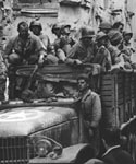 US truck driving through ruined streets in Naples