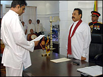 Champika Ranawaka (L) swearing in as a new minister