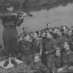 famous violinist and band leader Eugene Pini playing for his colleagues on 9th September 1941.  My father is ringed.