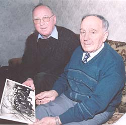 Sandy Heaney and Tom Newell examining the photograph of the tunnellers meeting in the middle