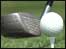 A golf club and ball