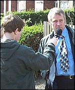 Clifton School pupil interviewing Peter Hawkridge