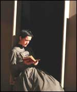 Anne sits readings as Bronte Sisters  at  haworth Parsonage