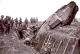 Image of British soldiers observing a ditched British tank