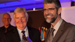 Philip Gross collects the 2010 Wales Book of the Year award from Minister for Heritage Alun Ffred Jones © Emyr Young / Academi