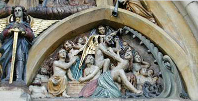 Close up of purgatory panel.  Judgement Day carving above entrance door of St Michael's, Enniskillen