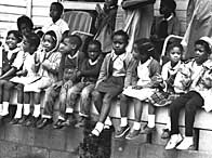 Children watching a black voting rights march in Alabama.  Martin Luther King led the march from Slema, Alabama, to the state capital in Montgomery