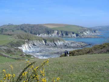 Looking back from the coast path towards Polridmouth Beach and beyond to Polruan.