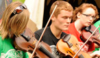On the final day of Cambridge Folk Festival, The Hub was full of budding folk musicians playing, learning and enjoying the event.