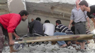 Nhà cửa bị tàn phá trong chiến sự ở Syria