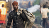 A scavenger visits the Olusosun rubbish dump, where people live on top of the rubbish in houses built from scrap
