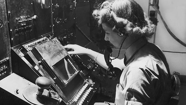 A member of the Women's Auxiliary Air Force (WAAF) tracking aircraft via radar in 1944. 

