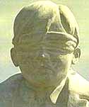 Photo of a memorial to those executed, modelled on Herbert Burden who was shot aged 17