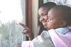 Thembi and her baby - image © UNICEF/ HQ06-1378/Giacomo Pirozzi