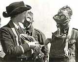 Image of a Wren training an army recruit in respirator drill
